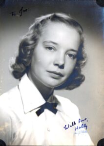 Photo of Holly Lucas, an attractive brunette-haired young woman with the inscription "To Joe, With Love, Holly."