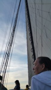 Holly Lucas looks out at the shoreline from Pete Seeger's sailing ship, the Clearwater